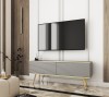 Szara szafka pod telewizor Oro RTV135 w salonie, wersja stojąca na eleganckich metalowych nóżkach w kolorze złotym, ryflowany front MDF
