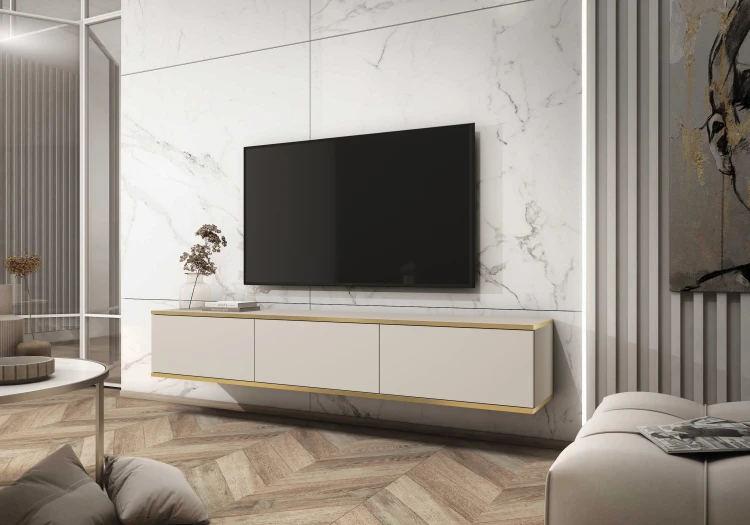 Aranżacja nowoczesnego salonu z wiszącą beżową szafką pod telewizor Oro RTV175, gładkie fronty i złote obrzeże, szerokość 175 cm