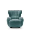 Morski fotel wypoczynkowy Ciro boucle prezentujący nowoczesny, obły design i ergonomiczną linię.