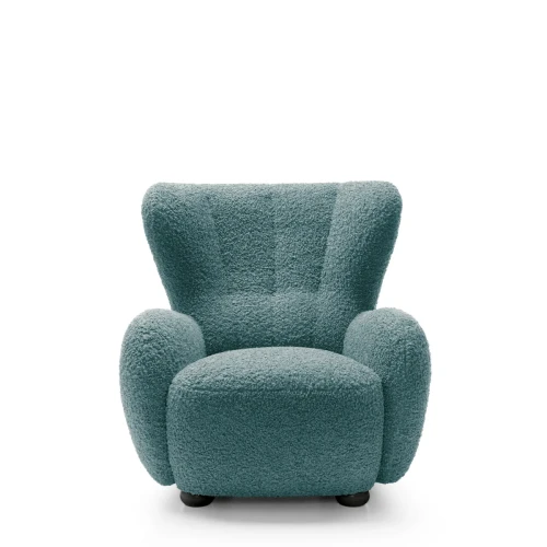 Morski fotel wypoczynkowy Ciro boucle prezentujący nowoczesny, obły design i ergonomiczną linię.
