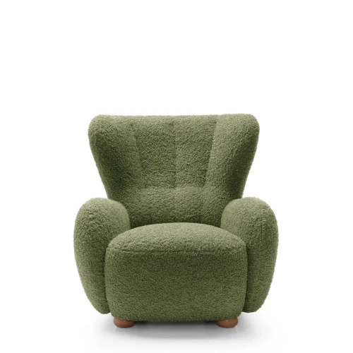 Zielony fotel wypoczynkowy Ciro boucle prezentujący nowoczesny, obły design i wysokie oparcie.